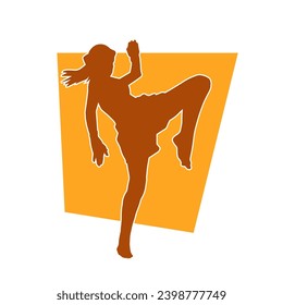 Silhouette of a woman kicking pose. Silhouette of a female martial art in action pose.