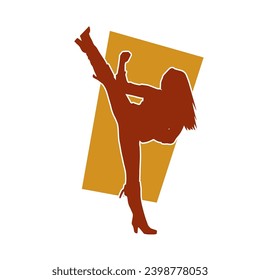 Silhouette of a woman kicking pose. Silhouette of a female martial art in action pose.