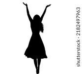 Silhouette of woman in long dress with arms raised up enjoying life