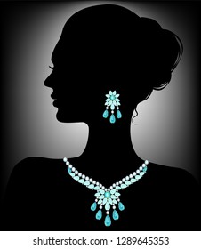 Silhouette of a woman in a necklace of diamonds and aquamarines