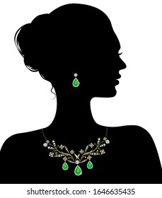 Silhouette of a woman in a necklace with diamonds and earrings