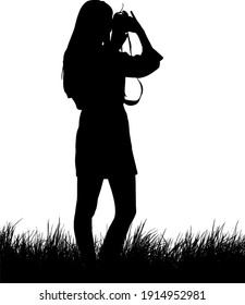 Silhouette of a woman photographer