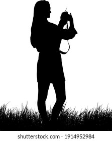 Silhouette of a woman photographer