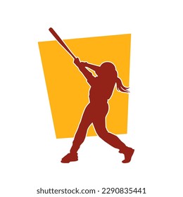 Silhouette de una mujer jugando béisbol. La silueta de una jugadora de béisbol en acción posan con un bate de béisbol.