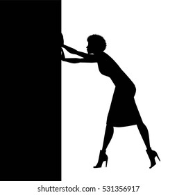 silhouette of woman pushing a barrier