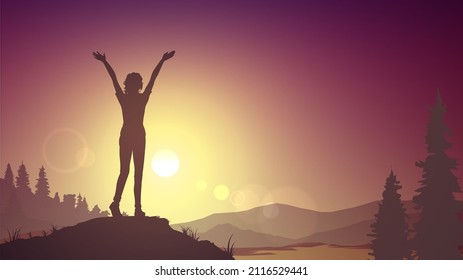 Silhouette of a woman with raised hands on the background of nature and sunset