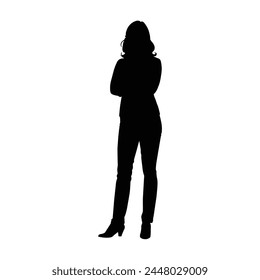 silhouette of a woman standing with folded arms 
