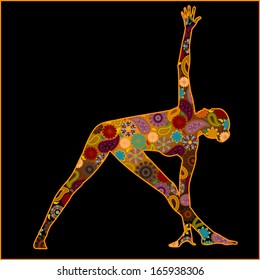 Silhouette of a woman in triangle pose or trikonasana with hindu symbols