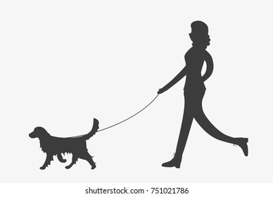 Silhouette of woman walking a golden retriever dog on leash. Girl with a pet. Female character and a dog.