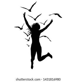 Silhouette of a woman who jump and birds flying