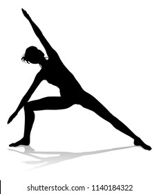 A silhouette of a woman in a yoga or pilates pose 