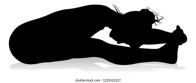 A silhouette of a woman in a yoga or pilates pose 