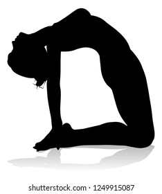 A silhouette of a woman in a yoga or pilates pose 