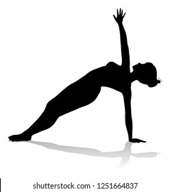 A silhouette of a woman in a yoga or pilates pose 