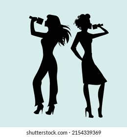 silhouette of the woman's  singing on microphone