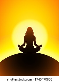 Silhouette of a women meditating in the lotus position with glowing sun disk in the background  