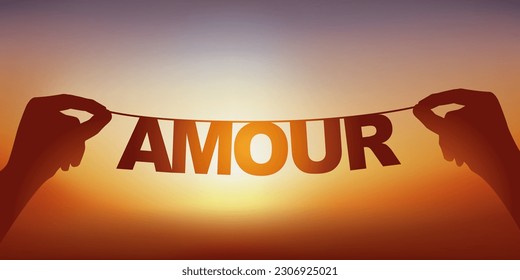 The silhouette of the word love written in loose letters on a garland facing a sunset.