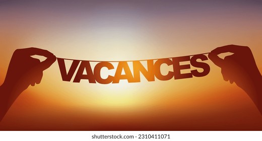 The silhouette of the word vacation written in loose letters on a garland against a sunset.