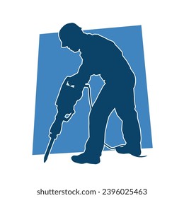 Silhouette of a worker in action pose holding drilling machine. Silhouette of a drill worker in action pose.