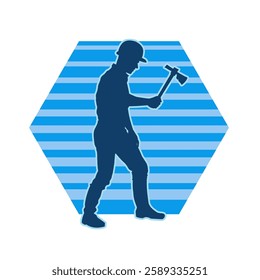 Silhouette of a worker in action pose using his axe tool.