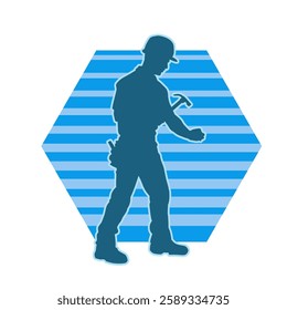 Silhouette of a worker carrying hammer tool. Silhouette of a worker in action pose using hammer tool.