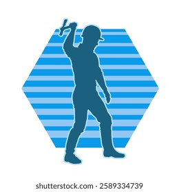 Silhouette of a worker carrying hammer tool. Silhouette of a worker in action pose using hammer tool.