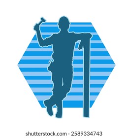 Silhouette of a worker carrying hammer tool. Silhouette of a worker in action pose using hammer tool.