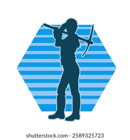 silhouette of a worker swinging a mattock tool. silhouette of a male labour wearing safety helmet holding grub axe.