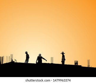 Silhouette of worker team standing on construction site
