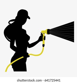 Silhouette of a working girl with a hose