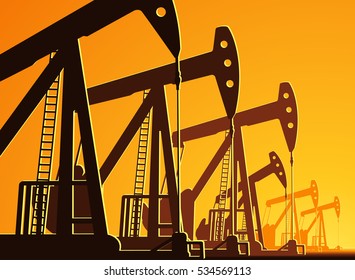 silhouette of working oil pumps on sunset background