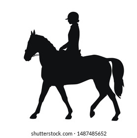 Silhouette of a young athlete performs on a sports pony