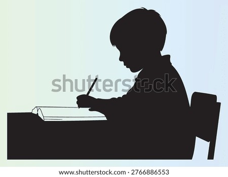 Silhouette of a young child sitting at a desk writing in a notebook with pencil