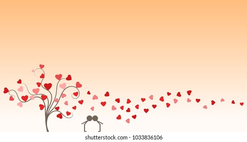 Silhouette of young couple in love kissing next to a tree and under hearts in anniversary day at sunset