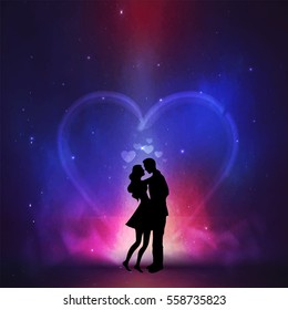 Silhouette of young couple on creative colorful night background for Happy Valentine's Day celebration.