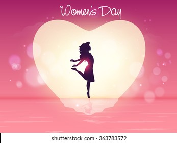 Silhouette of young girl in a heart on shiny creative background for Happy International Women's Day celebration.