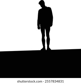 Silhouette of a young male standing alone in contemplation against a stark white background.