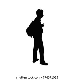 Silhouette of young man with backpack.
