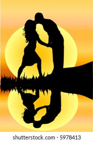 silhouette of young romantic couple kissing  by a river