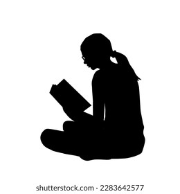 
Silhouette of a young woman reading a book