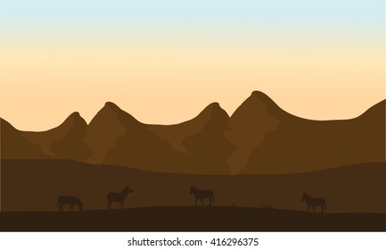 Silhouette of zebra in desert with brown background