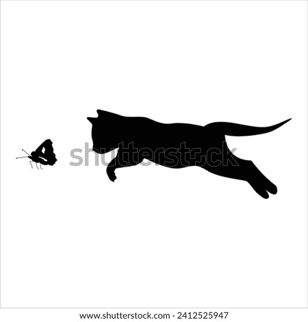 A silhouetted cat jumping and chasing a butterfly