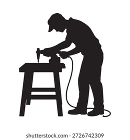 A silhouetted craftsman using a power tool on a workbench