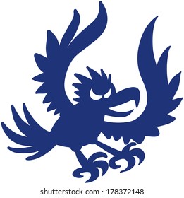 Silhouetted predatory bird when attacking by opening its wings and stretching its legs to catch a prey