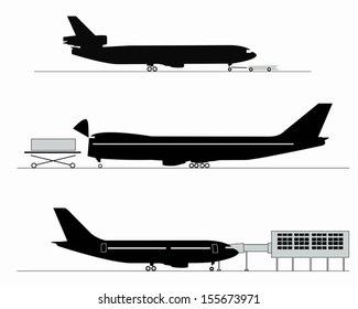 Silhouettes of aircraft at the airport