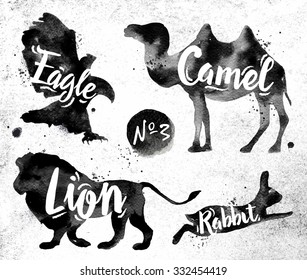 Silhouettes of animal camel, eagle, lion, rabbit drawing black paint on background of dirty paper