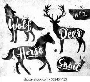 Silhouettes of animal deer, horse, snail, wolf drawing black paint on background of dirty paper
