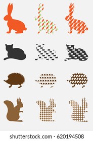 Silhouettes of animals with patterns isolated on a light background