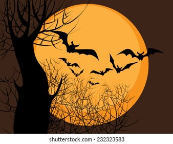 silhouettes of bats on a background of yellow moon