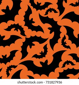 Silhouettes of bats on orange background. Seamless pattern . Halloween background.